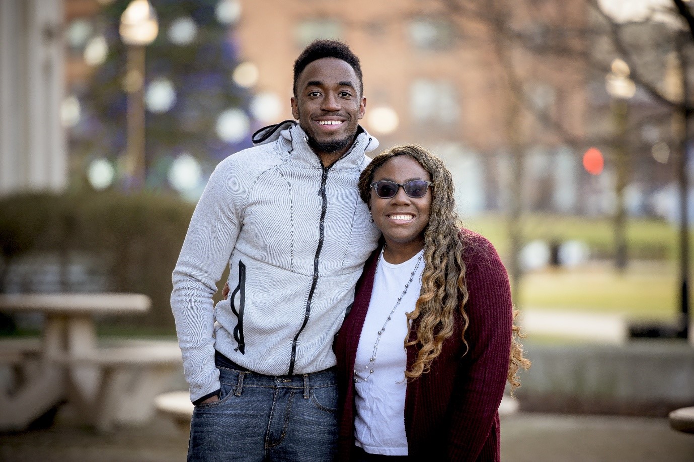 cute selective focus short of two friends smiling and posing together